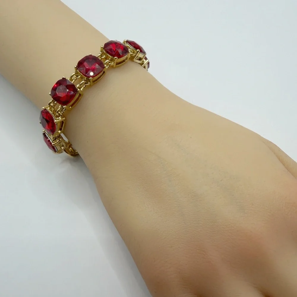 Cosmopolitan Gold Tone Red Crystal Bracelet | Cushion Cut Toggle Clasp